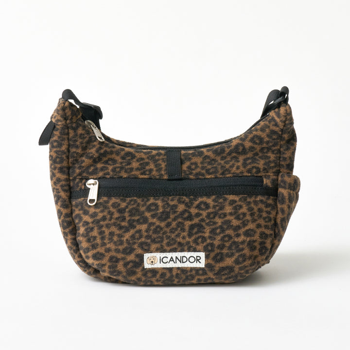 Crescent Bag in Leopard: front zip pocket, iCANDOR label and strap rings