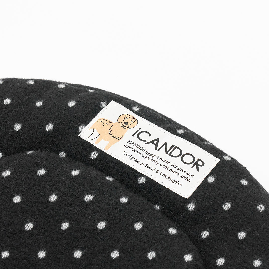 Urban Nest Cushion in Polka Dot: iCANDOR label on the polka-dot side, close-up