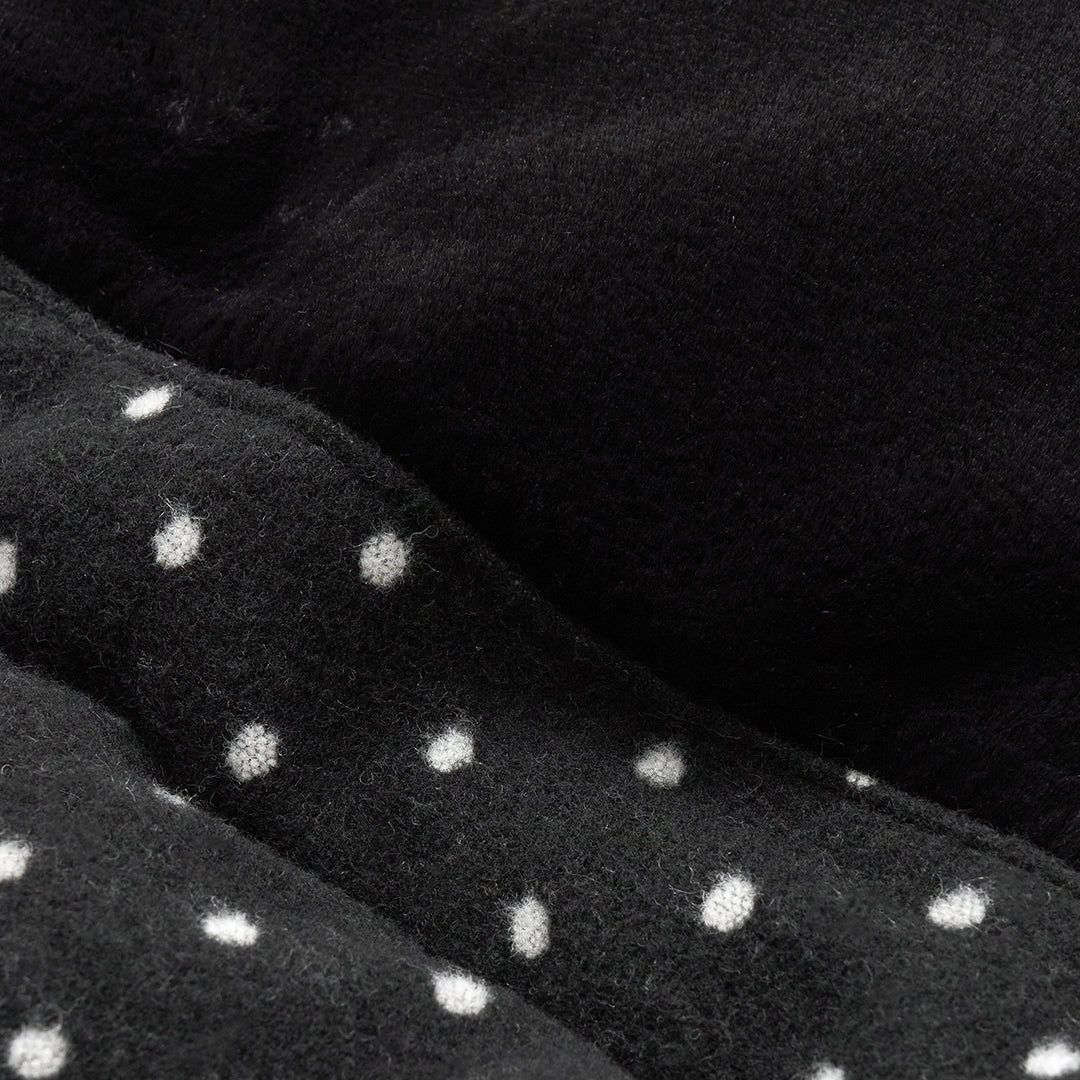 Urban Shield Cushion in Polka Dot: polka-dot fabric and black eco-fur close-up
