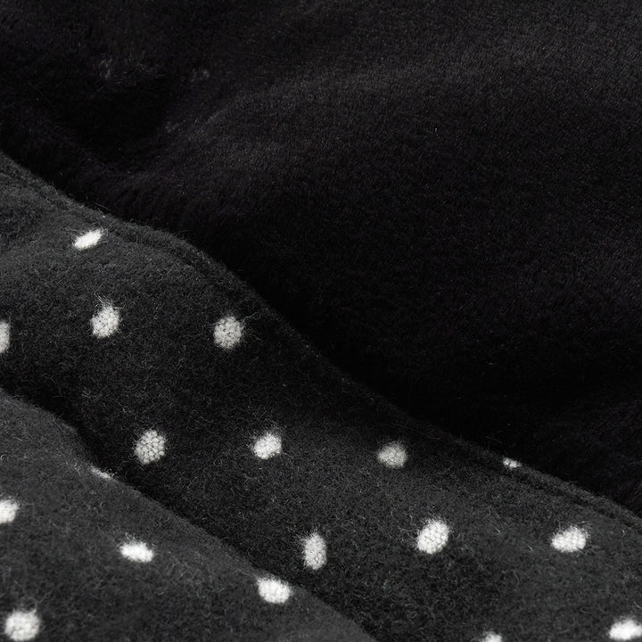 Urban Shield Cushion in Polka Dot: polka-dot fabric and black eco-fur close-up