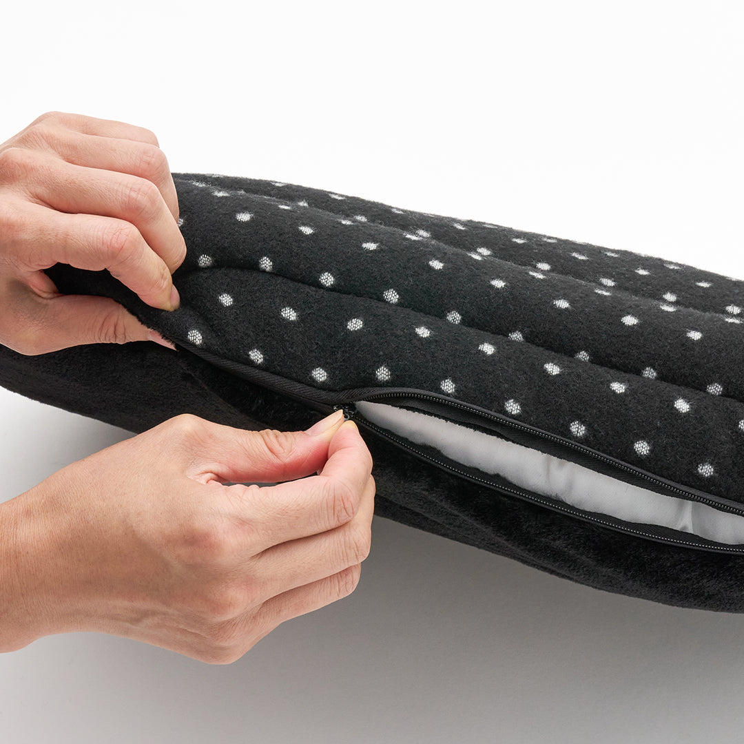 Urban Nest Cushion in Polka Dot: unzipping the removable cover to take out the insert