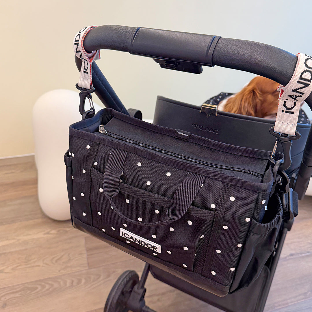 Urban Stroll Bag in Polka Dot: hung on a dog stroller with a brown dog inside
