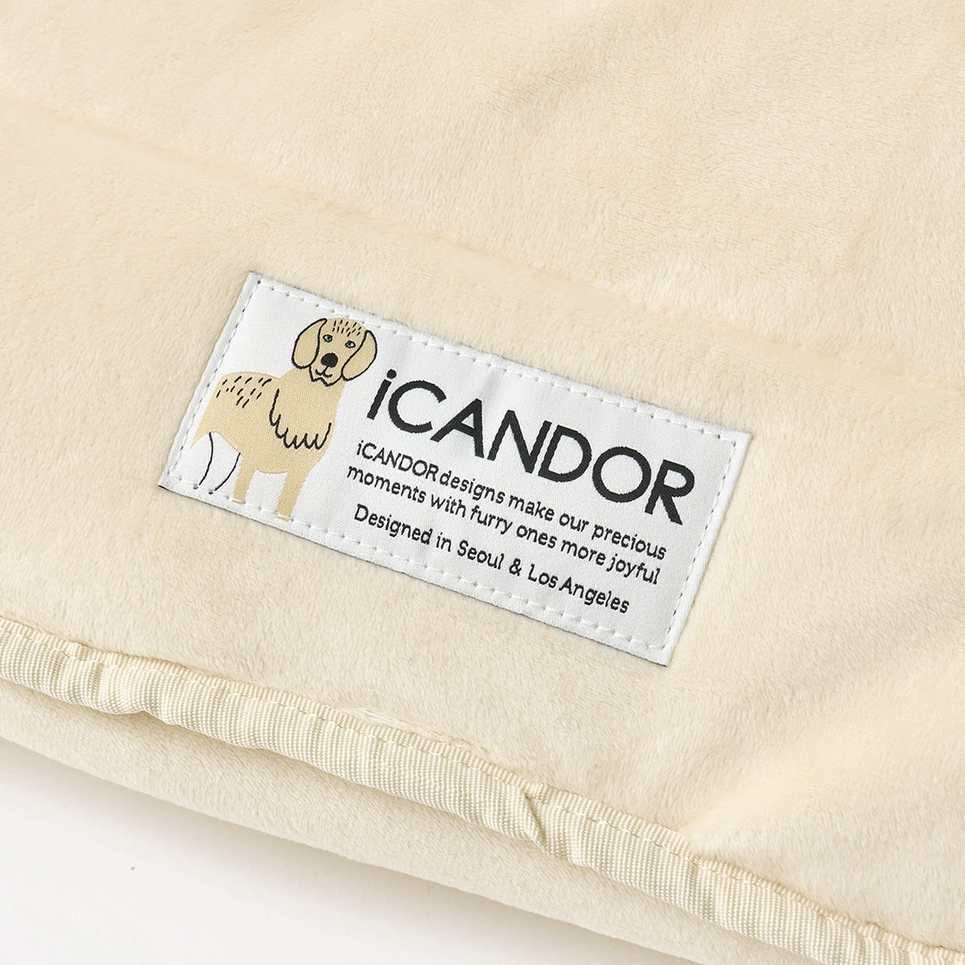 Snuggle Nest: iCANDOR label on the velboa shell, close-up