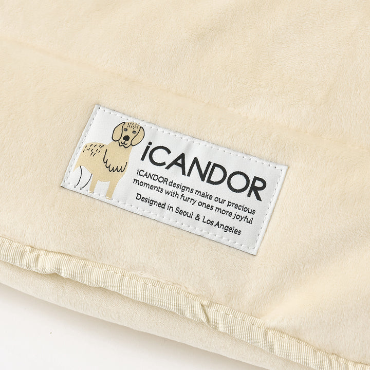 Snuggle Nest: iCANDOR label on the velboa shell, close-up