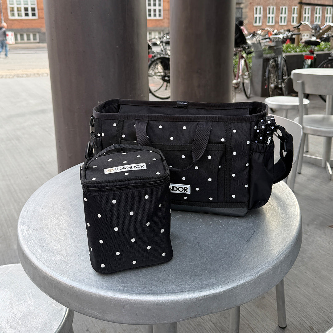Urban Stroll Bag in Polka Dot: with the extra cooler bag on an outdoor café table