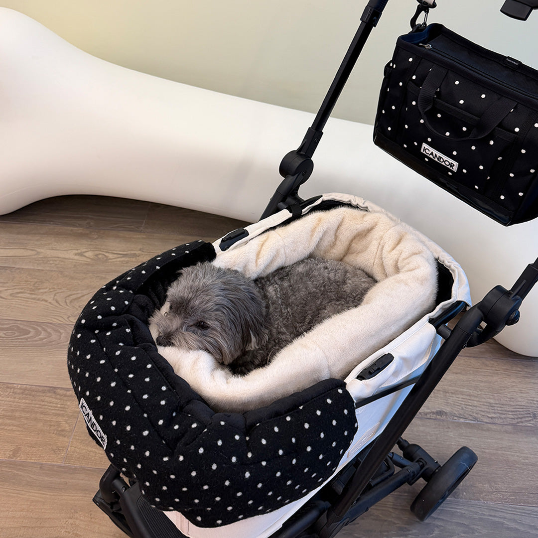 Snuggle Nest: gray dog resting in the nest in a stroller with the Polka Dot Urban Shield Cushion and Urban Stroll Bag